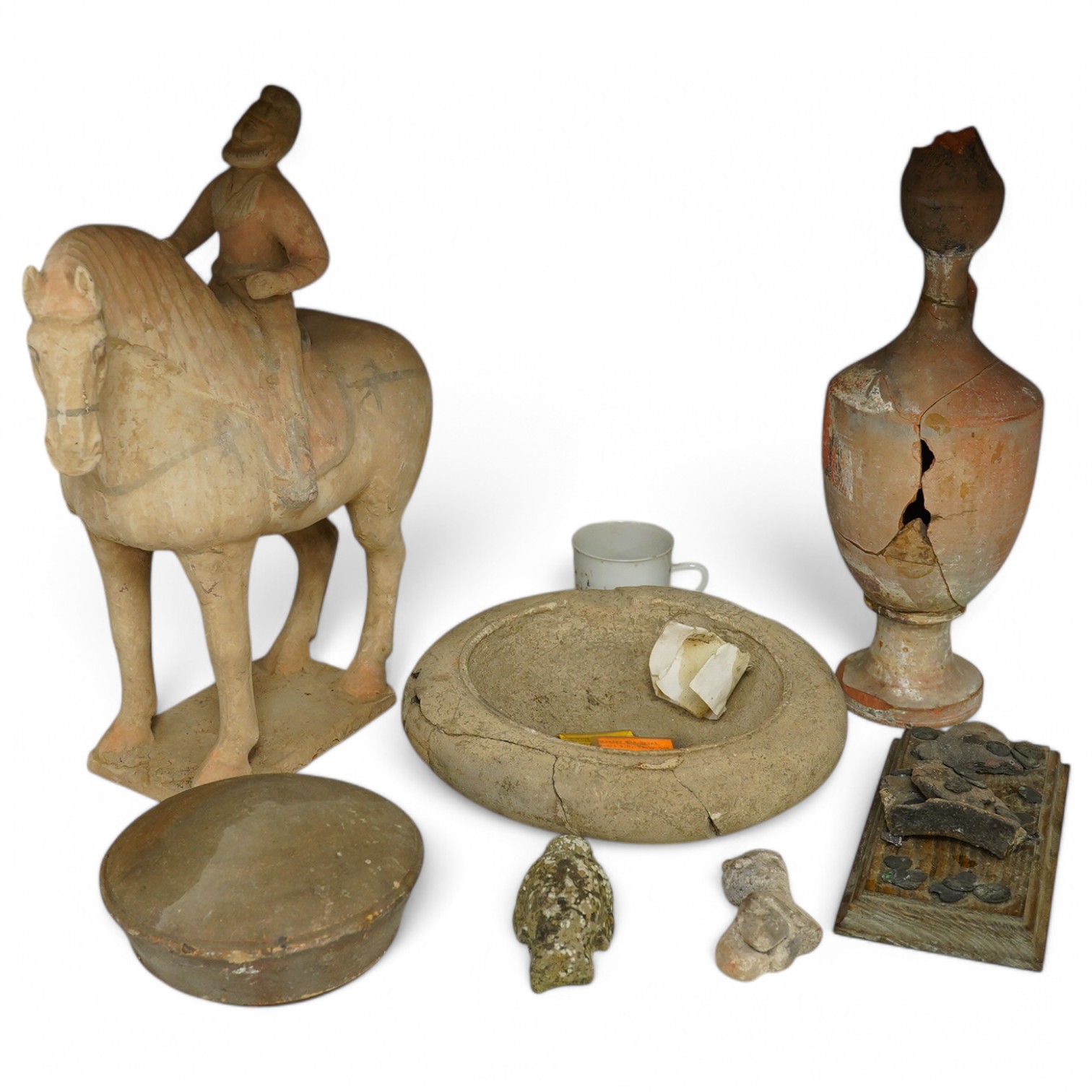 A group of antiquities- pottery and coins, including a later white glazed cup. Tallest 39cm high. Condition - fair to good considering age.